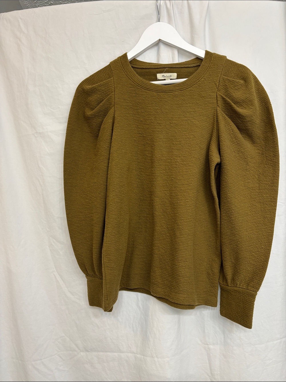 Madewell army green long-sleeve top with gathered puff shoulders.